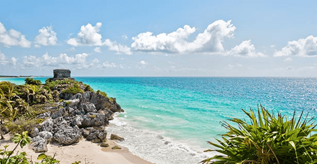 A beach with rocks and water on it