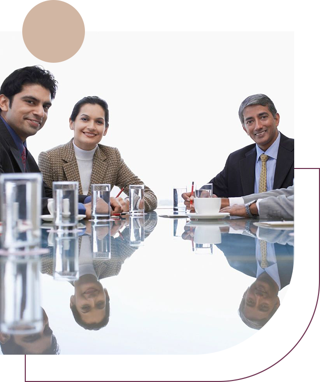 A group of people sitting at a table with drinks.