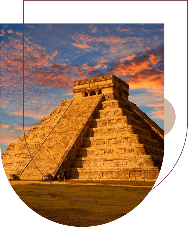 A picture of the mayan pyramid in front of a sunset.