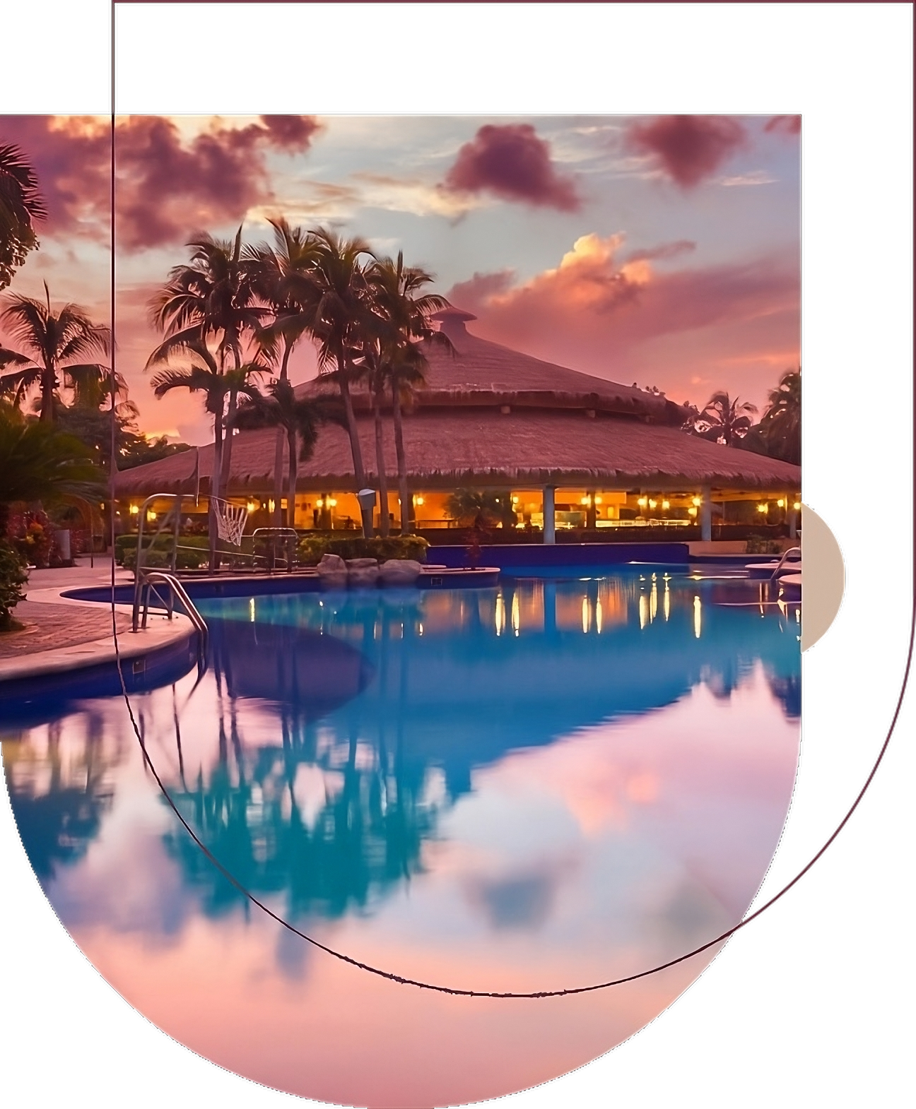 A pool with palm trees and a building in the background.